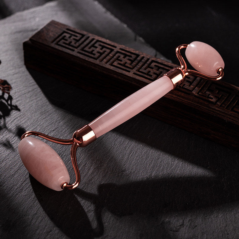 Rose quartz gua sha set with roller, scrapers, and knife rod