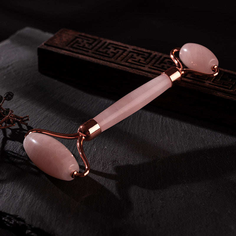 Rose quartz gua sha scraping tool close-up